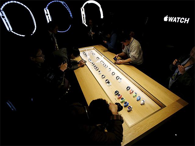 media-crew-members-crowd-around-display-case
